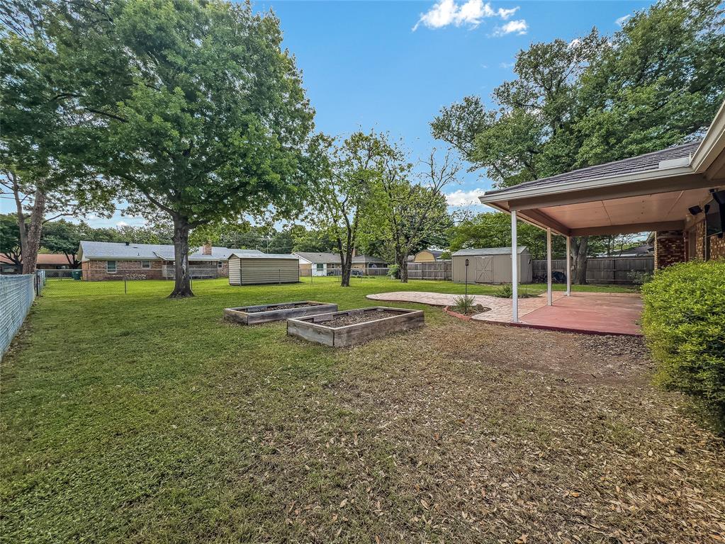 220 Cooper Drive Hurst, TX 76053 - Photo 26 of 27 a view of yard with tree and green space