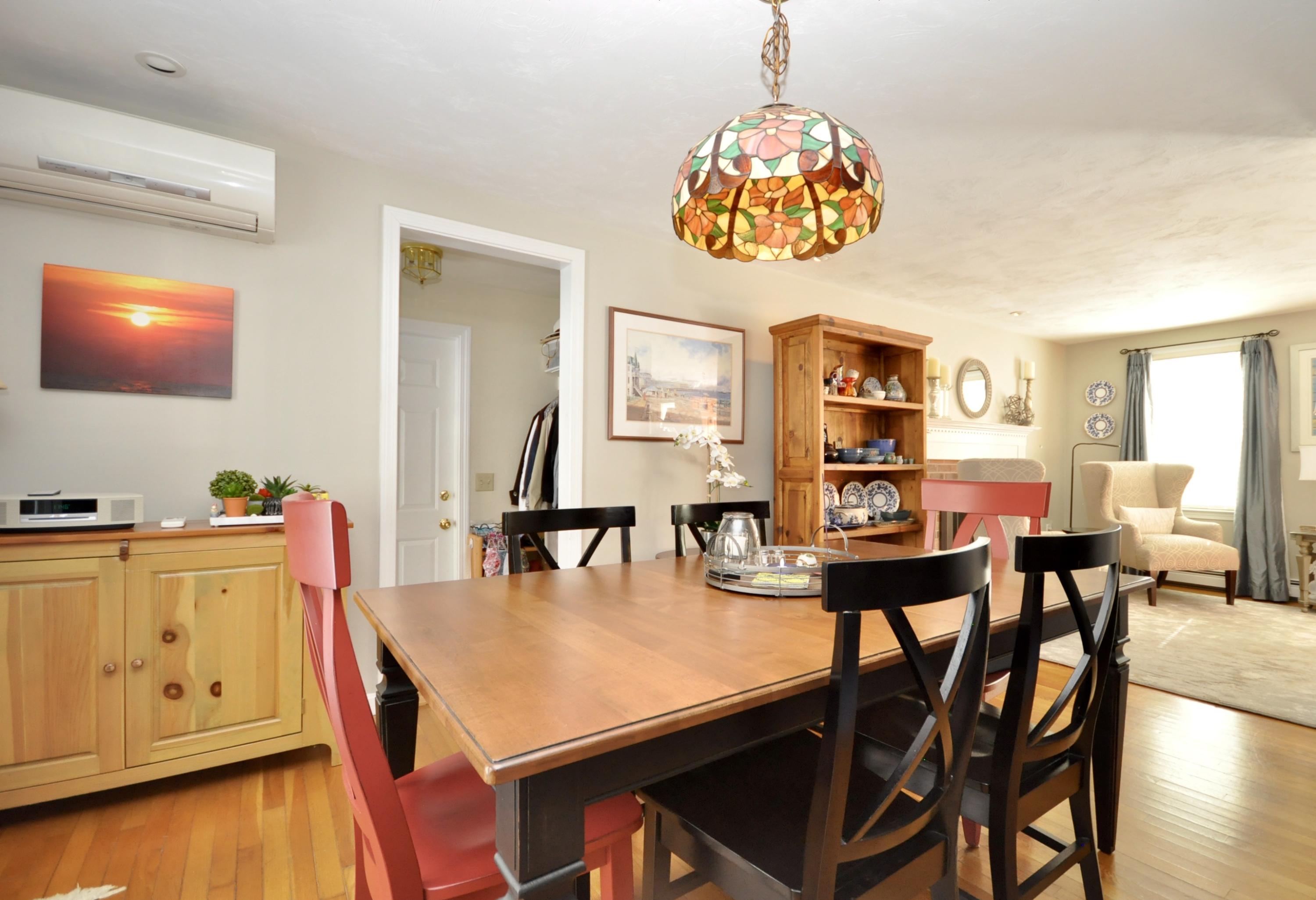 6 Cunningham Road Sagamore Beach, MA 02562 - Photo 12 of 34 a view of a dining room with furniture and wooden floor