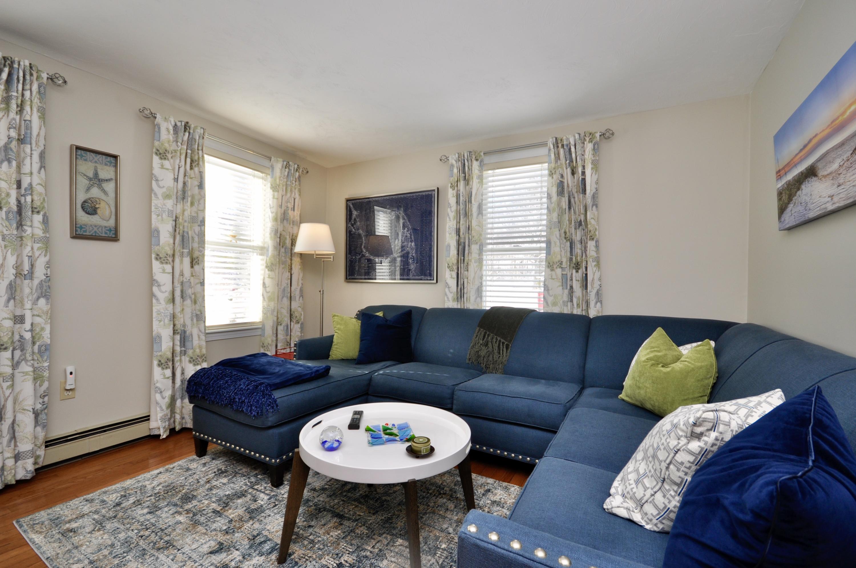 6 Cunningham Road Sagamore Beach, MA 02562 - Photo 15 of 34 a living room with furniture and a large window