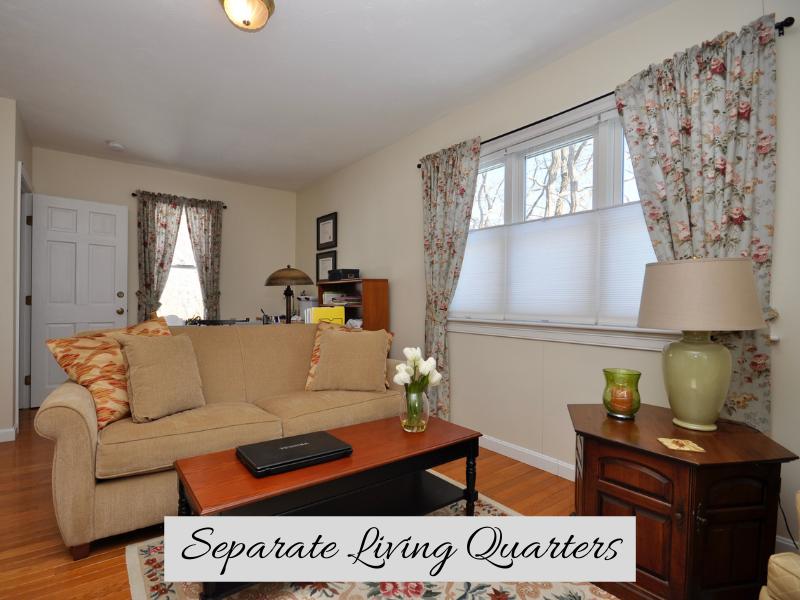 6 Cunningham Road Sagamore Beach, MA 02562 - Photo 23 of 34 a living room with furniture and a lamp