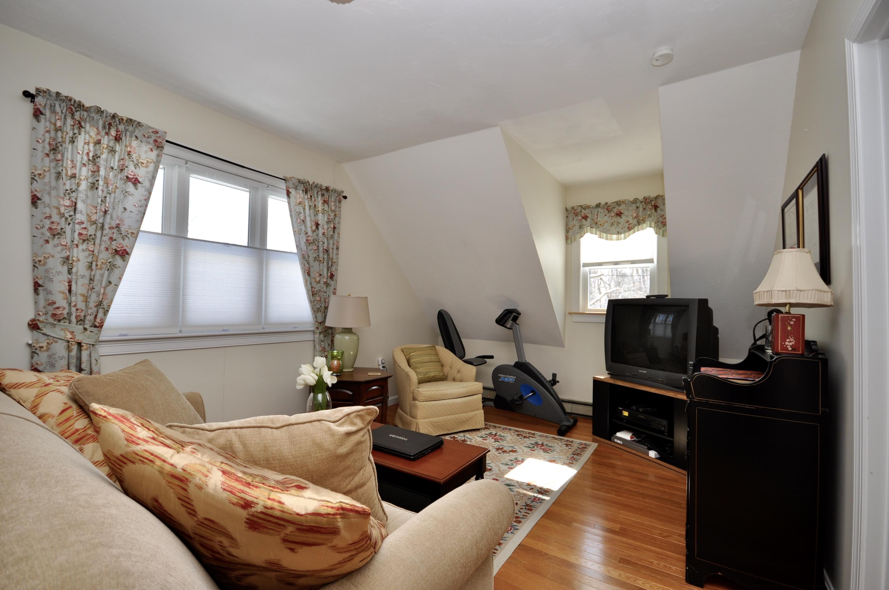 6 Cunningham Road Sagamore Beach, MA 02562 - Photo 24 of 34 a living room with furniture and a flat screen tv