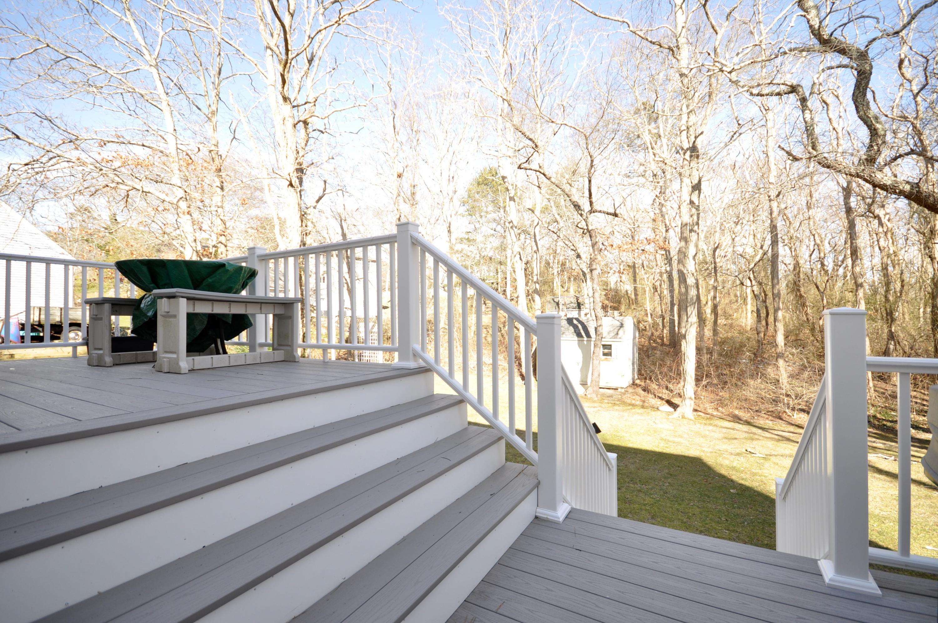 6 Cunningham Road Sagamore Beach, MA 02562 - Photo 28 of 34 a balcony with wooden floor table and chairs