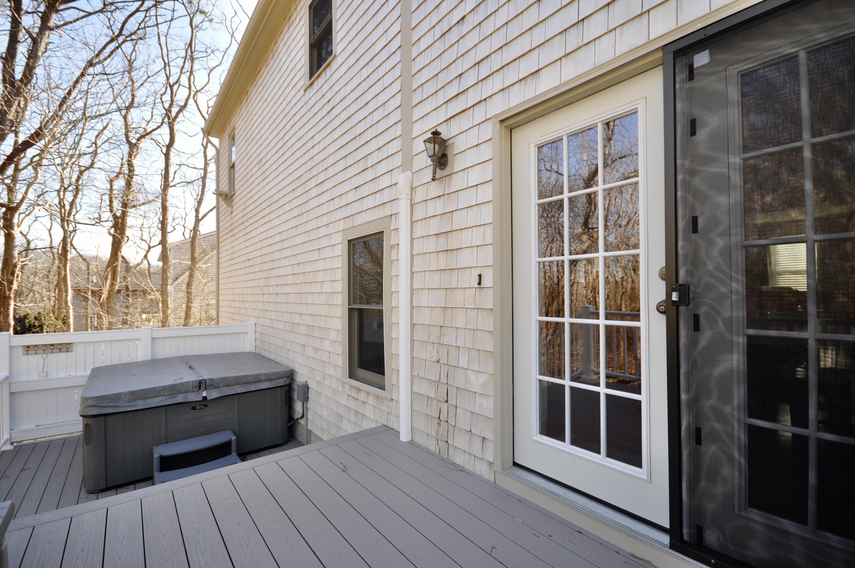 6 Cunningham Road Sagamore Beach, MA 02562 - Photo 29 of 34 a backyard of a house with wooden floor and outdoor seating