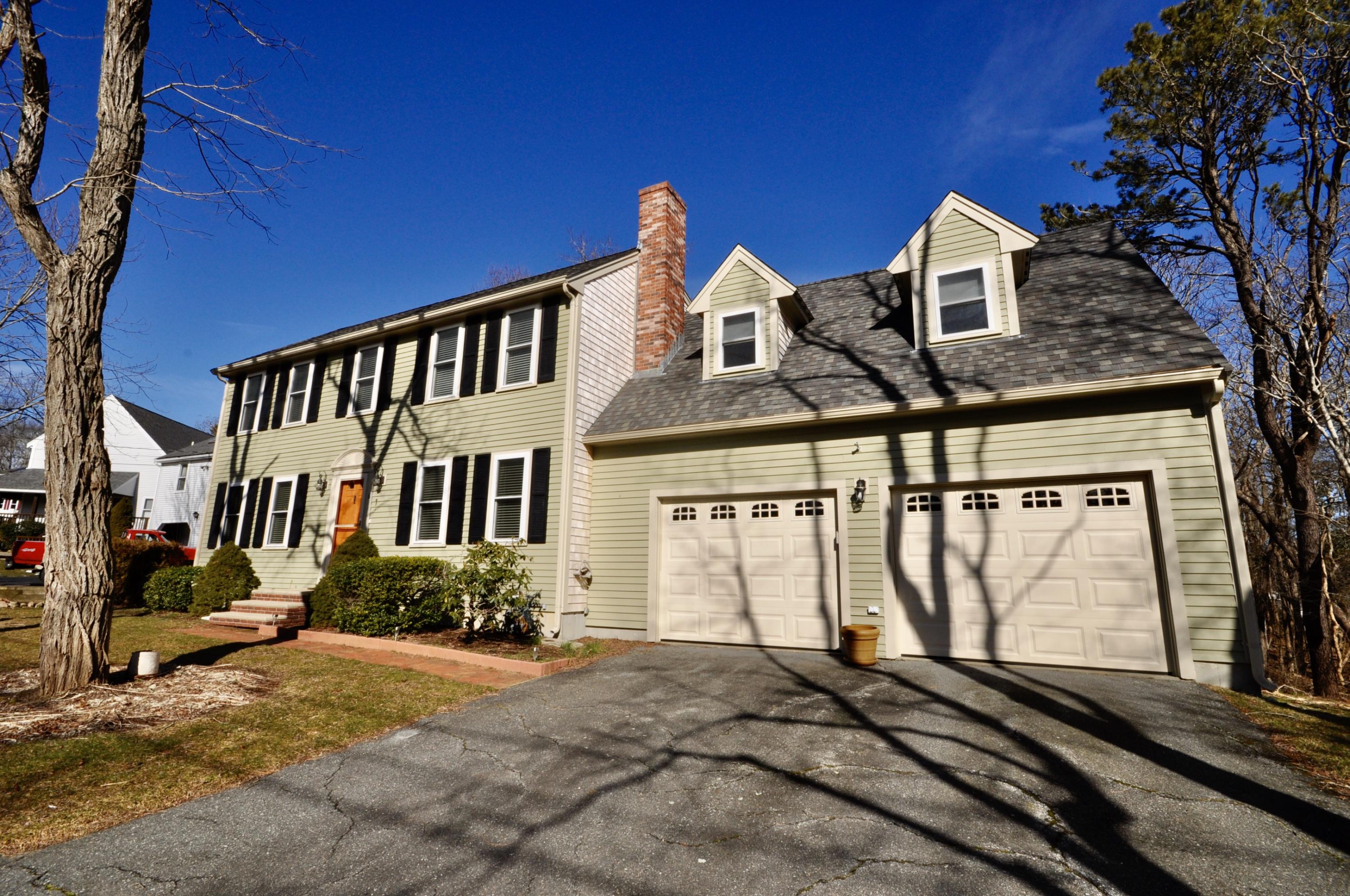6 Cunningham Road Sagamore Beach, MA 02562 - Photo 3 of 34 front view of a house with a yard