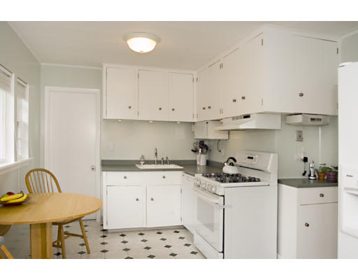 162 Overlook Road Arlington, MA 02474 - Photo 4 of 12 a kitchen with granite countertop a sink a stove and cabinets