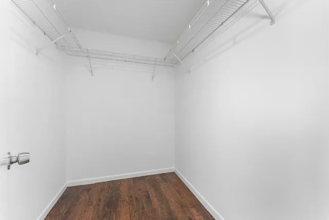 an aerial view of a house with swimming pool big yard and large trees