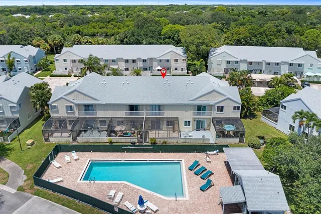 an aerial view of residential houses with outdoor space