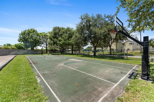 an aerial view of a house with a yard and pool