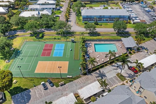 a view of a lake with couches and wooden floor