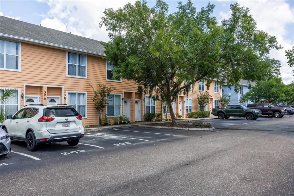 3970 Southwest 20th Avenue, Unit 909 Gainesville, FL 32607 - Photo 1 of 22 a view of street with parked cars