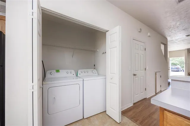 a utility room with dryer and washer