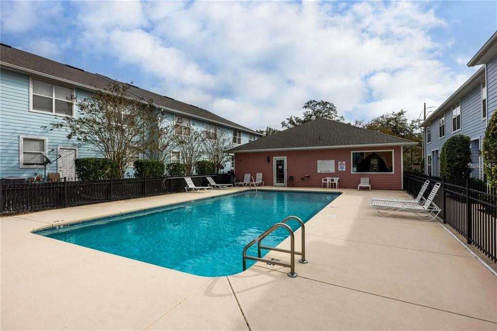 3970 Southwest 20th Avenue, Unit 909 Gainesville, FL 32607 - Photo 21 of 22 a view of house with swimming pool and furniture