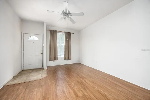 a view of an empty room with a window