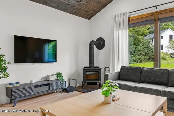 a view of a lush green hillside and houses