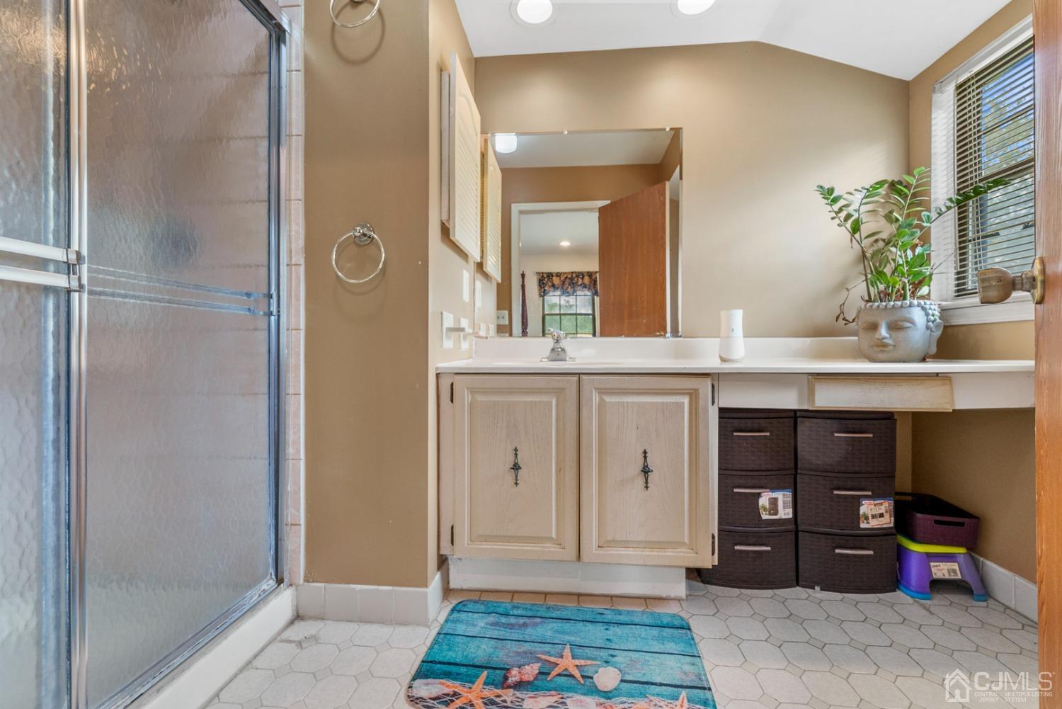 301 Maplecrest Road Edison, NJ 08820 - Photo 13 of 21 a spacious bathroom with a granite countertop sink and a mirror