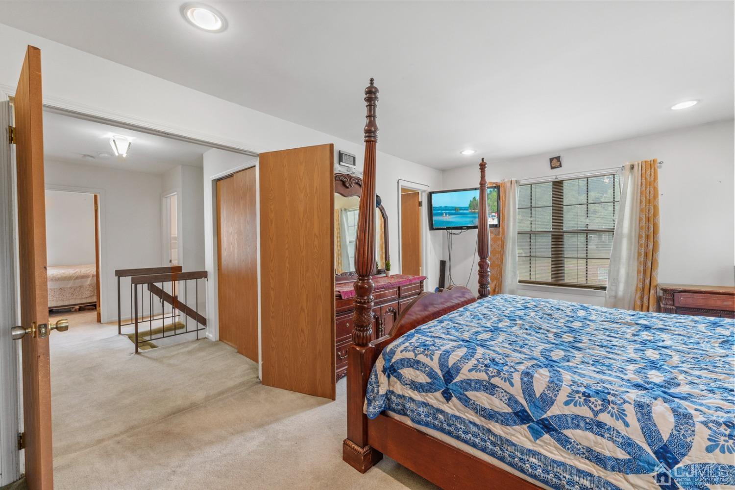 301 Maplecrest Road Edison, NJ 08820 - Photo 14 of 21 a bedroom with a bed dresser and a window