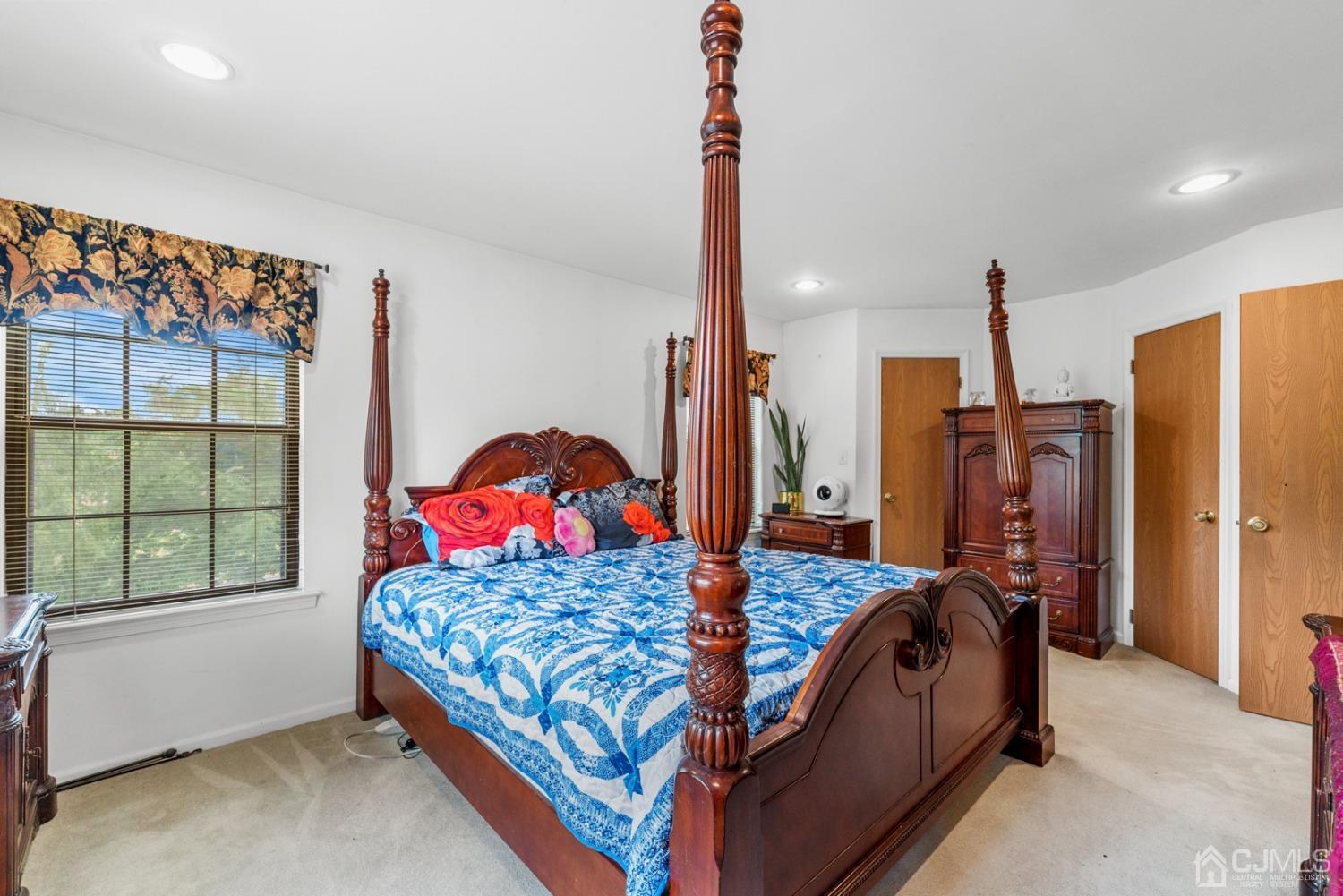 301 Maplecrest Road Edison, NJ 08820 - Photo 15 of 21 a bedroom with a bed next to a window with outer view