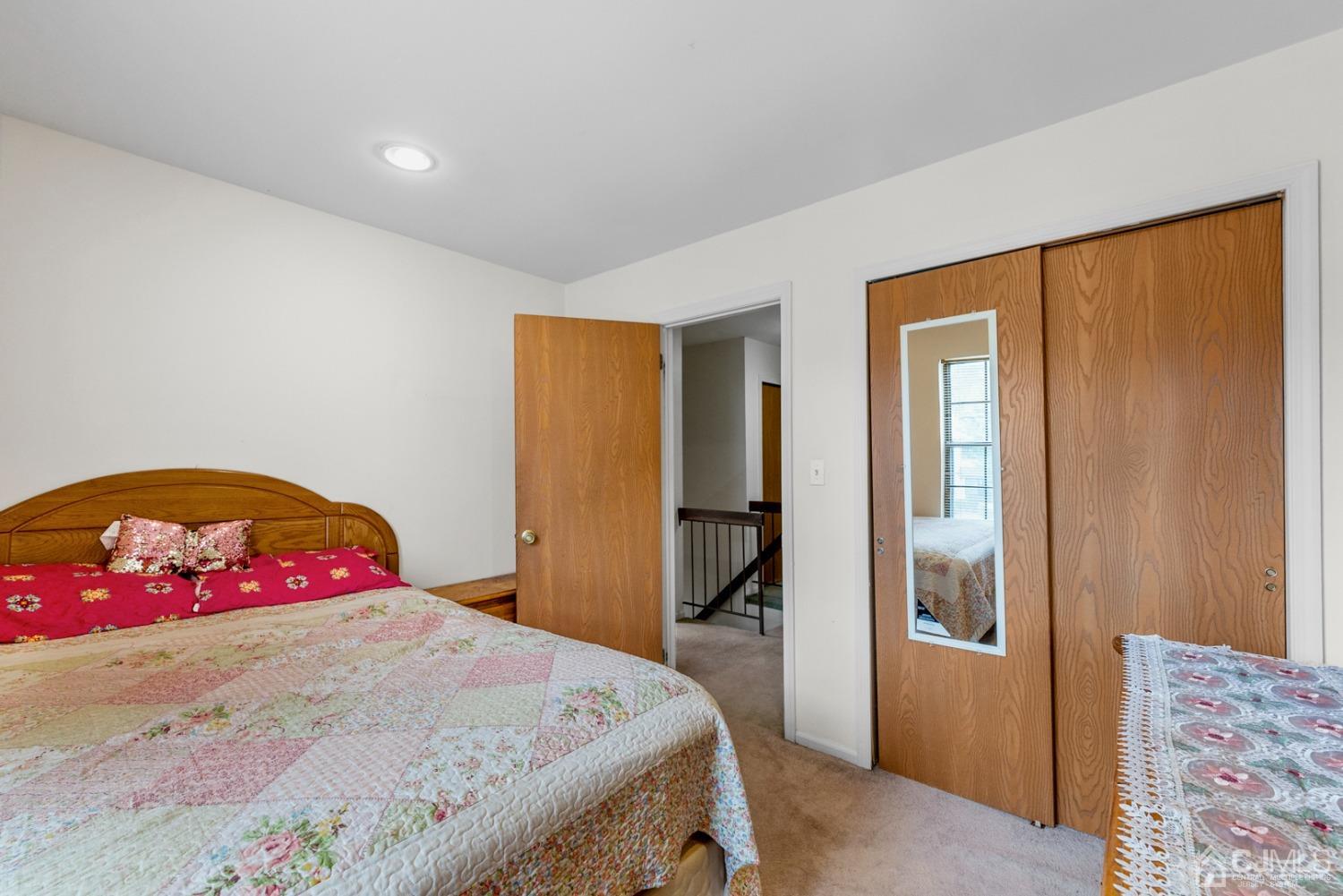 301 Maplecrest Road Edison, NJ 08820 - Photo 16 of 21 a bedroom with a bed and a dresser