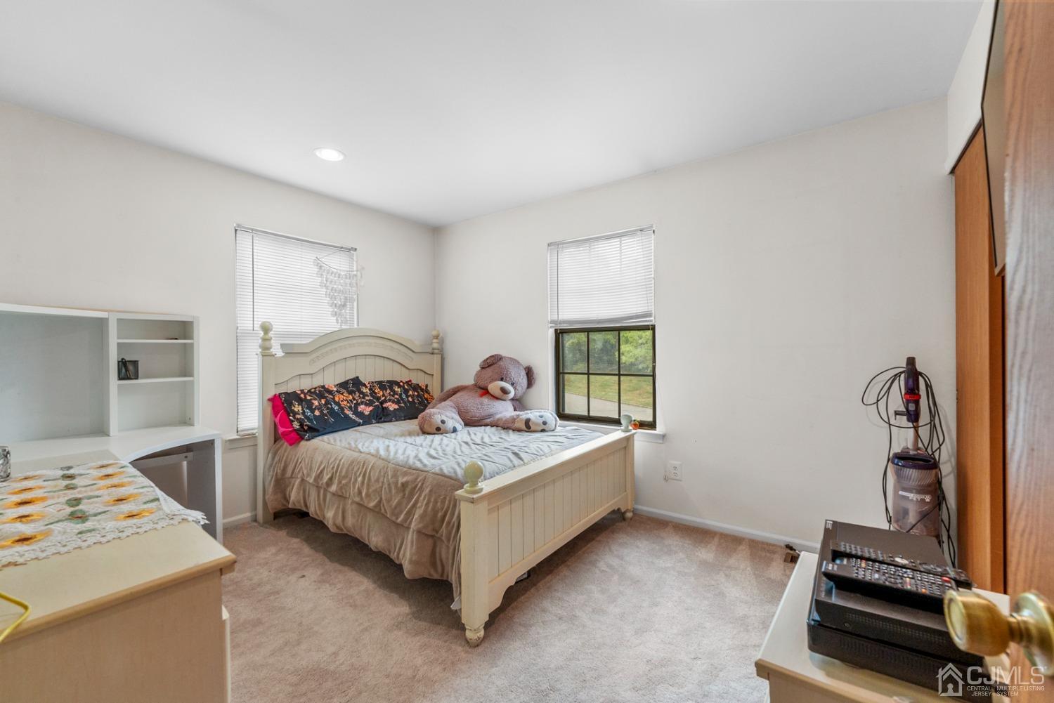 301 Maplecrest Road Edison, NJ 08820 - Photo 18 of 21 a bedroom with a bed and a window