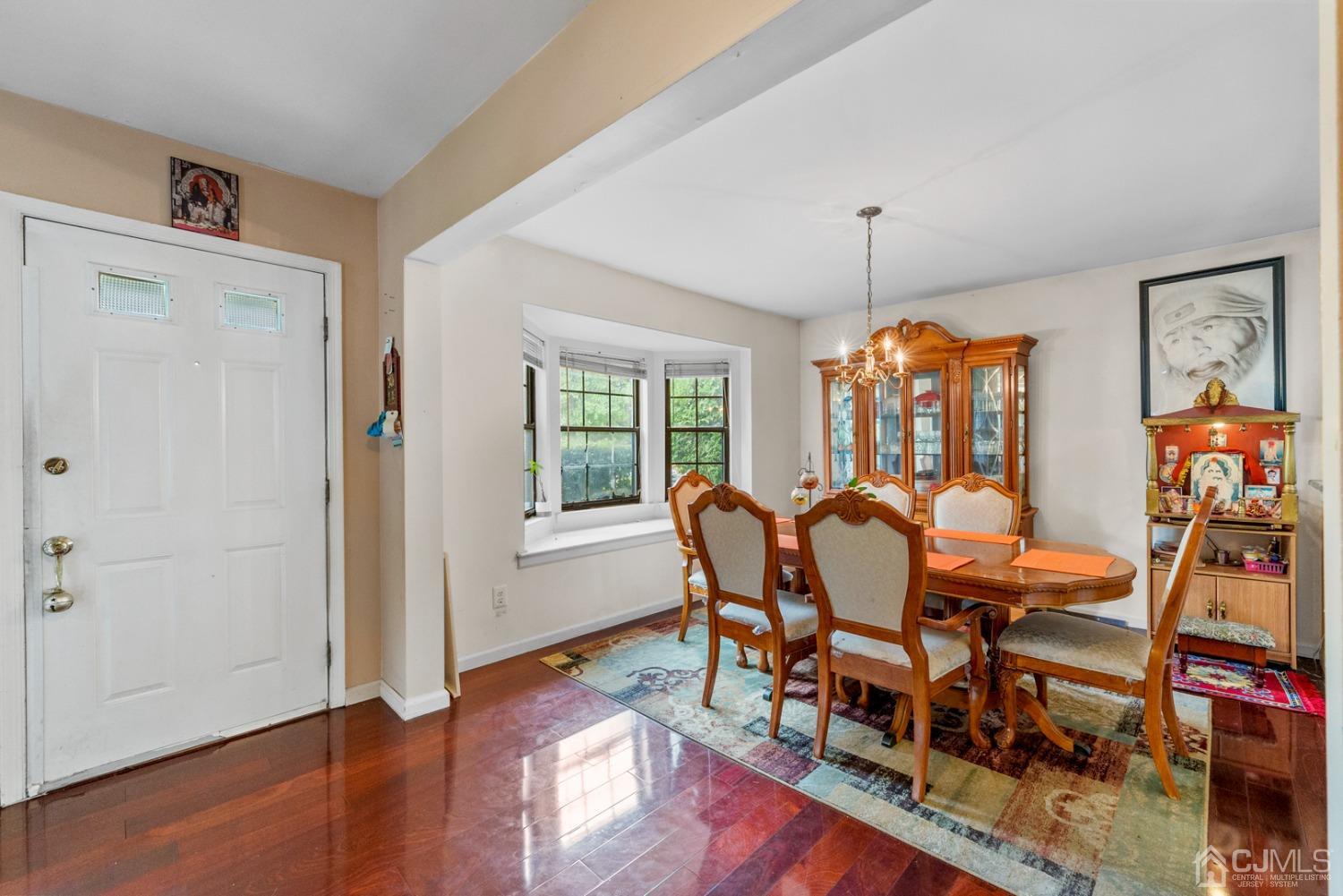 301 Maplecrest Road Edison, NJ 08820 - Photo 3 of 21 a view of a dining room with furniture window and wooden floor