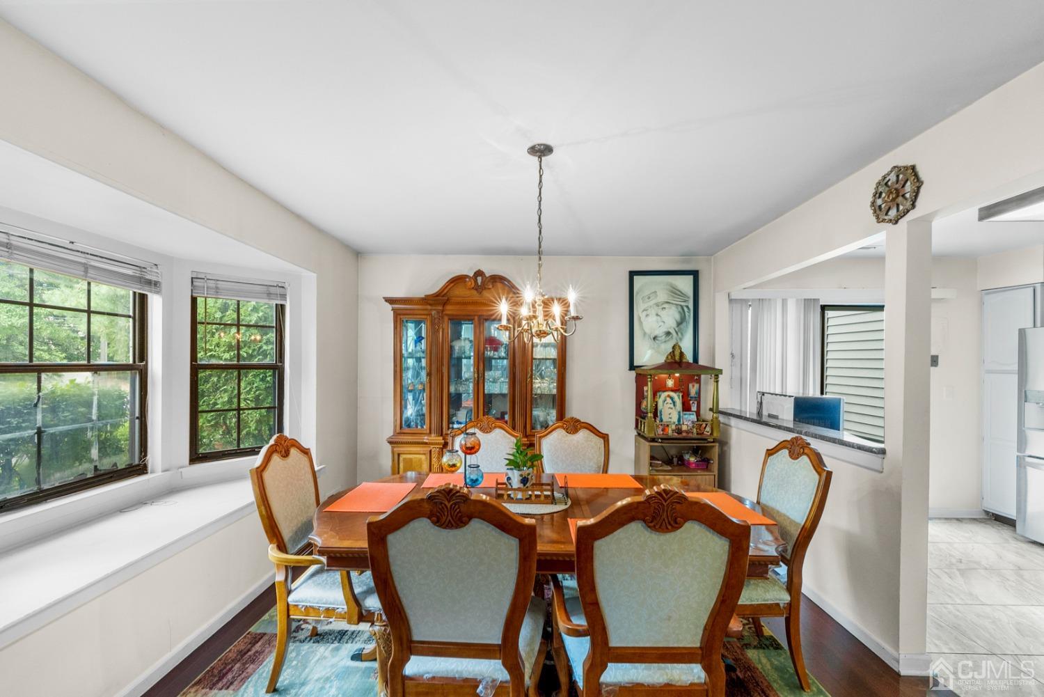 301 Maplecrest Road Edison, NJ 08820 - Photo 4 of 21 a view of a dining room with furniture window and outside view