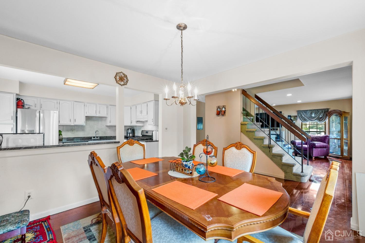 301 Maplecrest Road Edison, NJ 08820 - Photo 5 of 21 a dining room with furniture and wooden floor