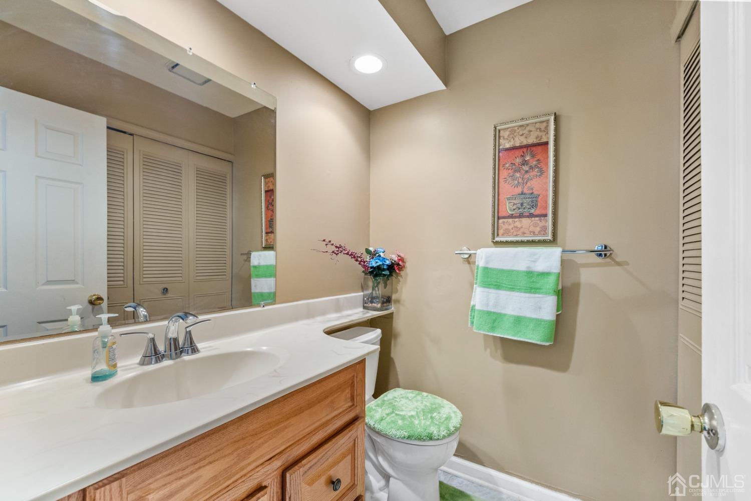 301 Maplecrest Road Edison, NJ 08820 - Photo 8 of 21 a bathroom with a granite countertop sink and a mirror