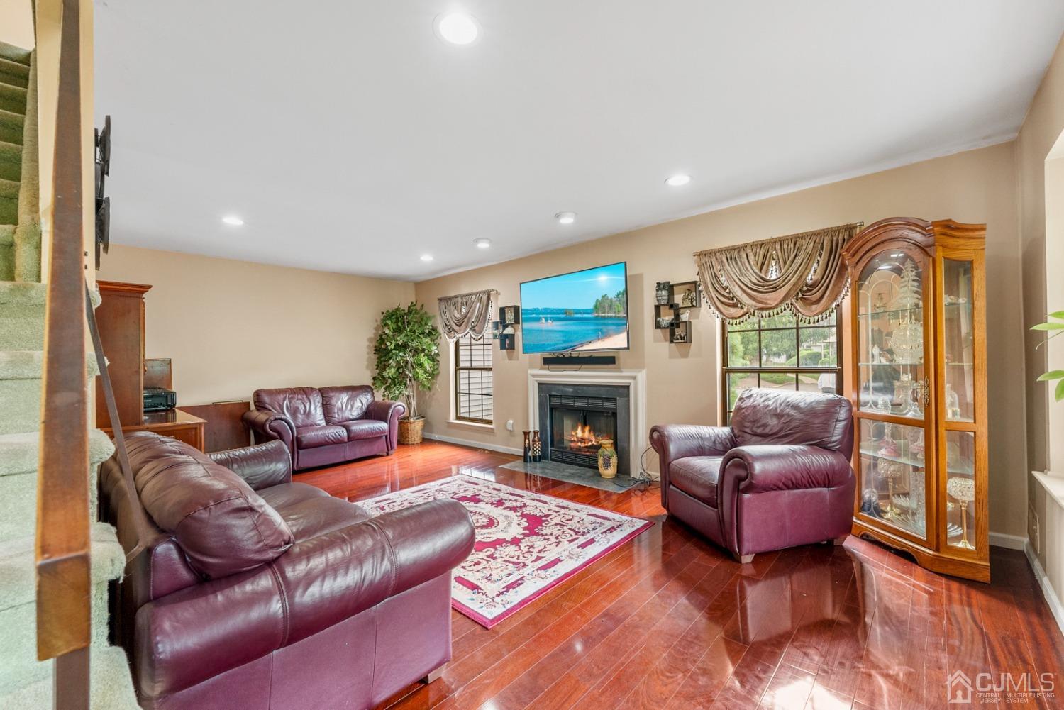 301 Maplecrest Road Edison, NJ 08820 - Photo 9 of 21 a living room with furniture or couch and a fireplace