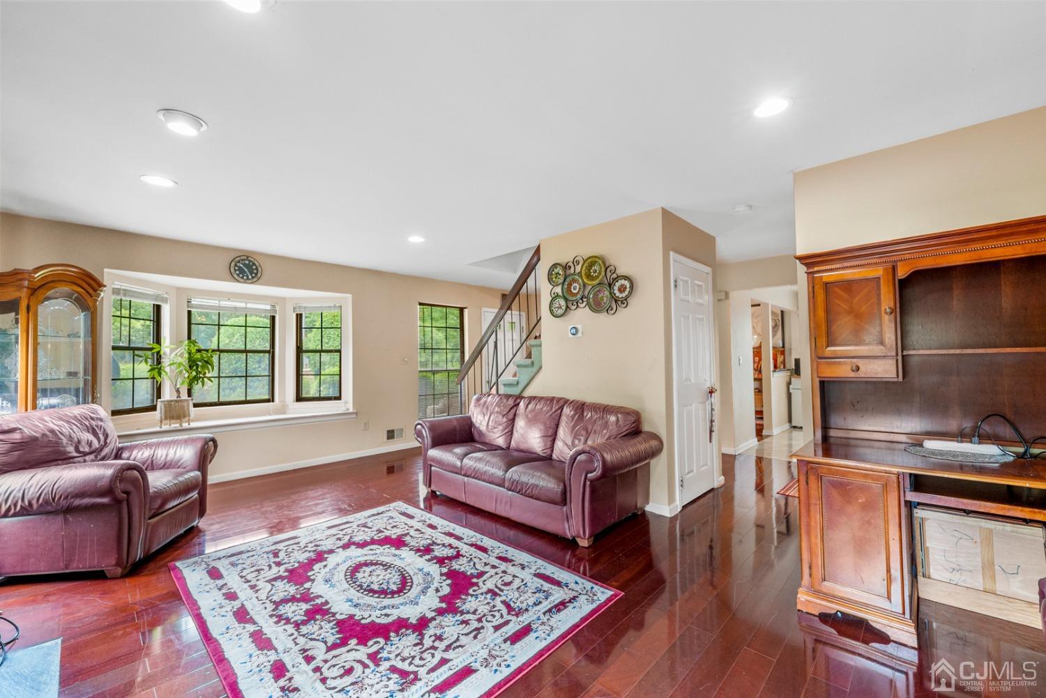 301 Maplecrest Road Edison, NJ 08820 - Photo 10 of 21 a living room with furniture and a rug
