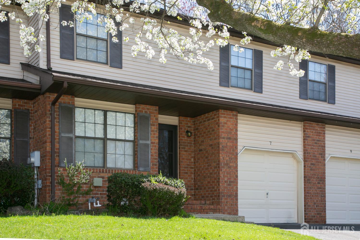 a view of a house with a yard and plants