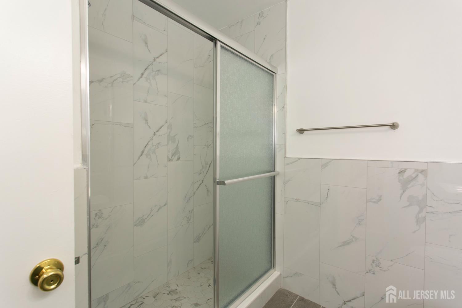 7 Cactus Court Edison, NJ 08820 - Photo 22 of 38 a bathroom with a shower