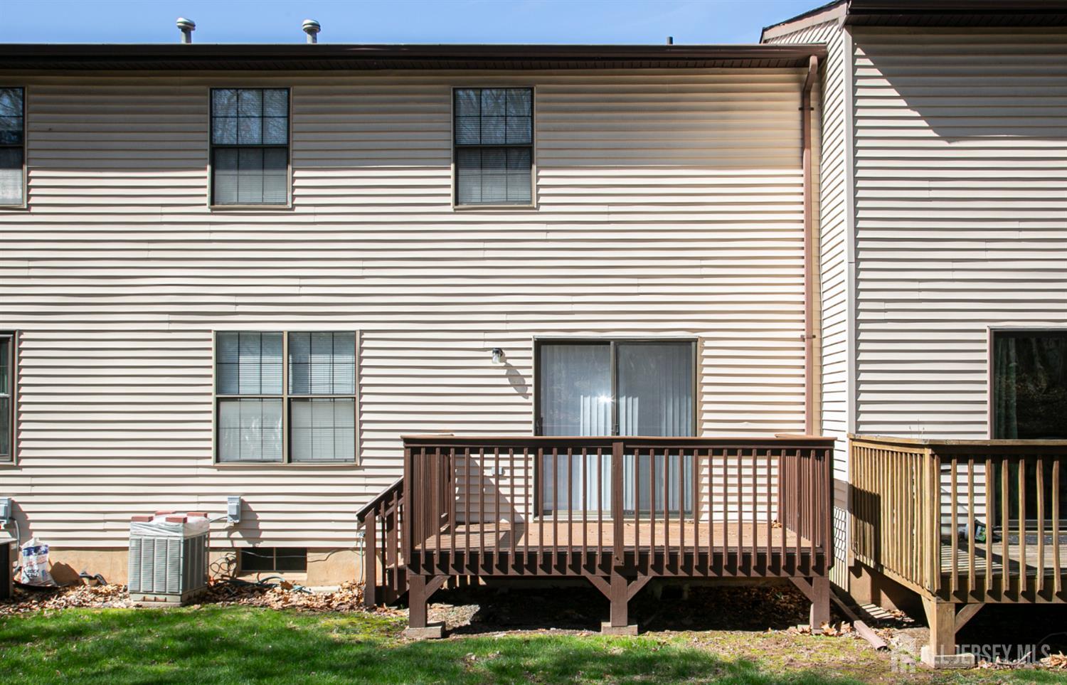 7 Cactus Court Edison, NJ 08820 - Photo 28 of 38 a view of a house with a small yard and a large window