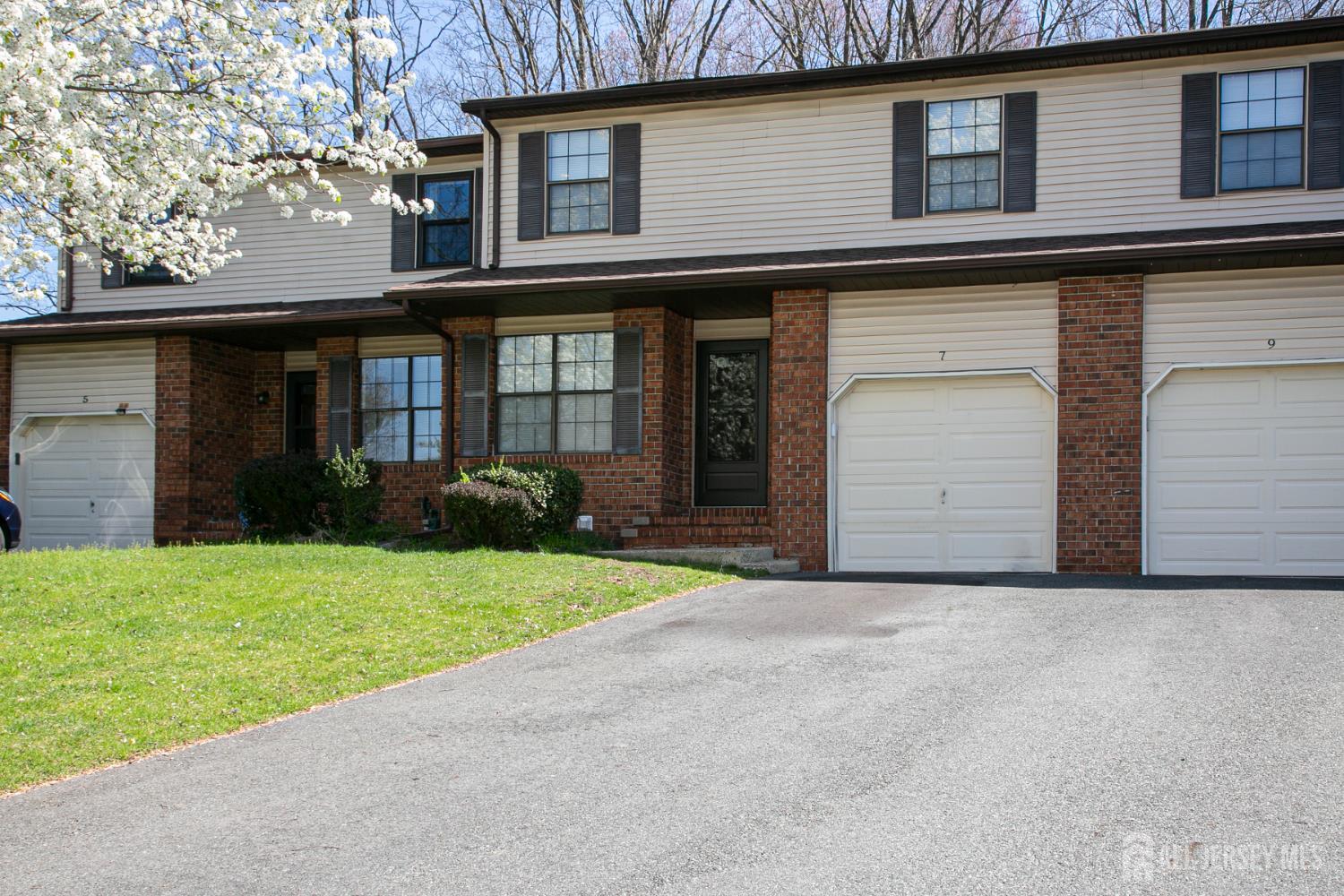 7 Cactus Court Edison, NJ 08820 - Photo 3 of 38 a view of a house with a yard and garage