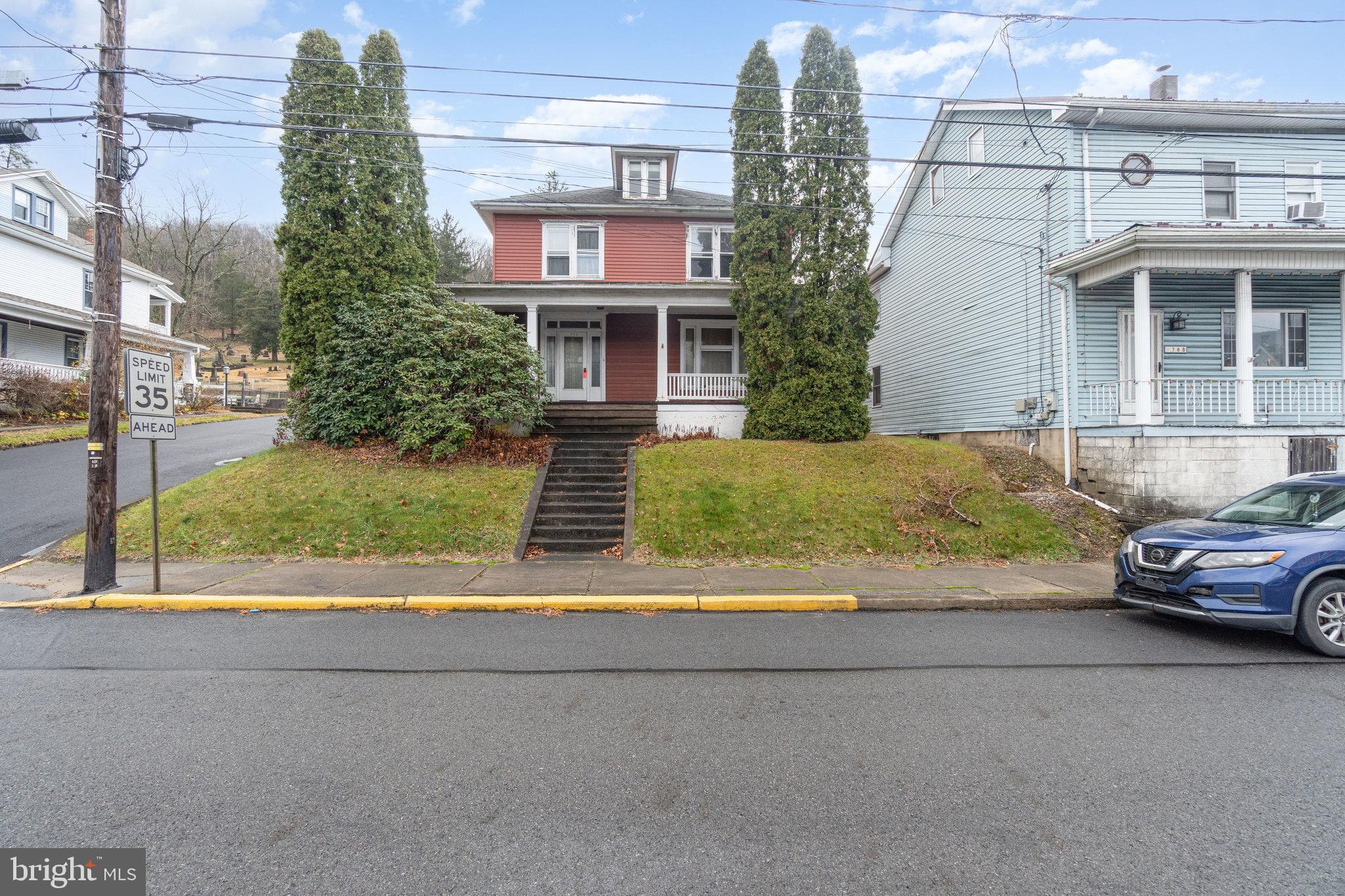 770 Main Street Lykens, PA 17048 - Photo 1 of 26 a front view of a house with a yard and garage