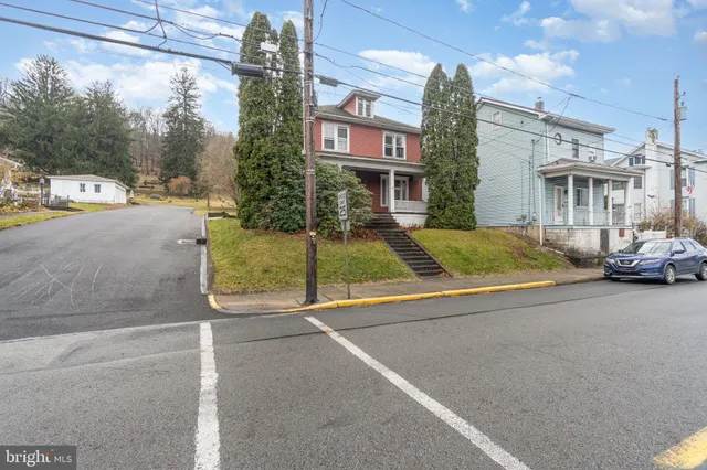 a view of a street with cars