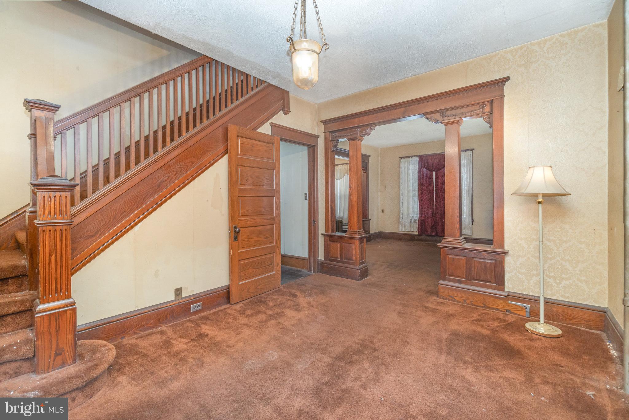 770 Main Street Lykens, PA 17048 - Photo 5 of 26 a view of a hallway with wooden floor and staircase