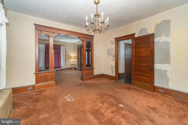 a kitchen with stainless steel appliances a stove a sink and a refrigerator
