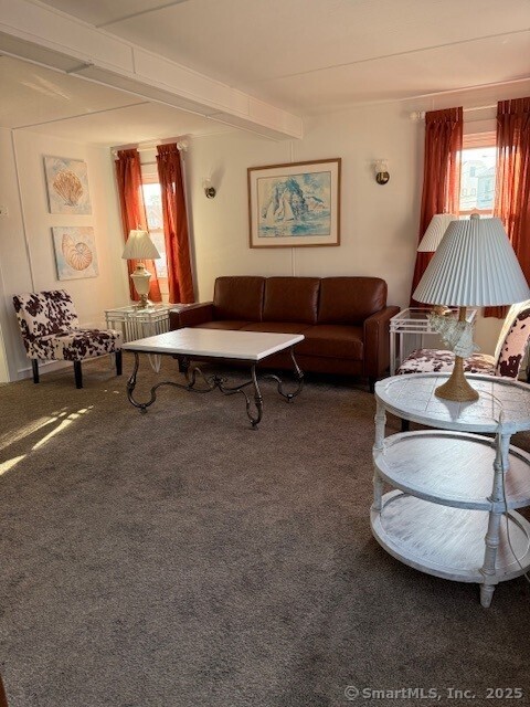 2142 Fairfield Beach Road Fairfield, CT 06824 - Photo 19 of 39 a living room with furniture and a lamp