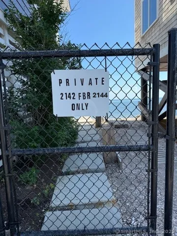 a view of a fence and a signage