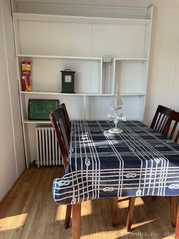 a view of bedroom with wooden floor