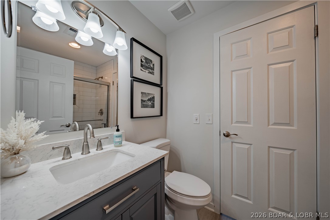 5940 Baydy Peak Road, Unit 1123 Osage Beach, MO 65065 - Photo 11 of 36 Bathroom with Walk-in Shower