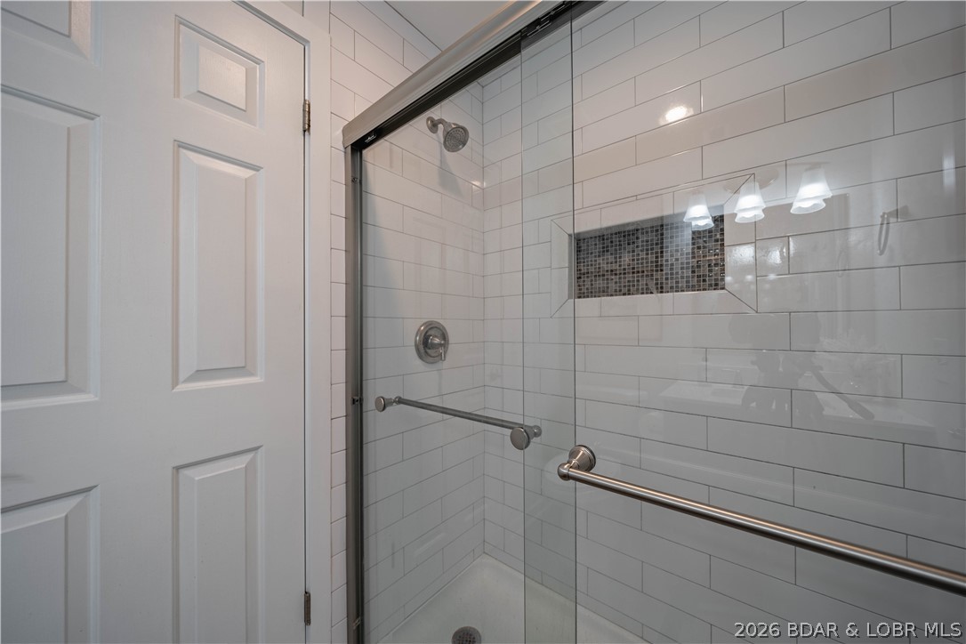 5940 Baydy Peak Road, Unit 1123 Osage Beach, MO 65065 - Photo 12 of 36 Bathroom with Walk-in Shower