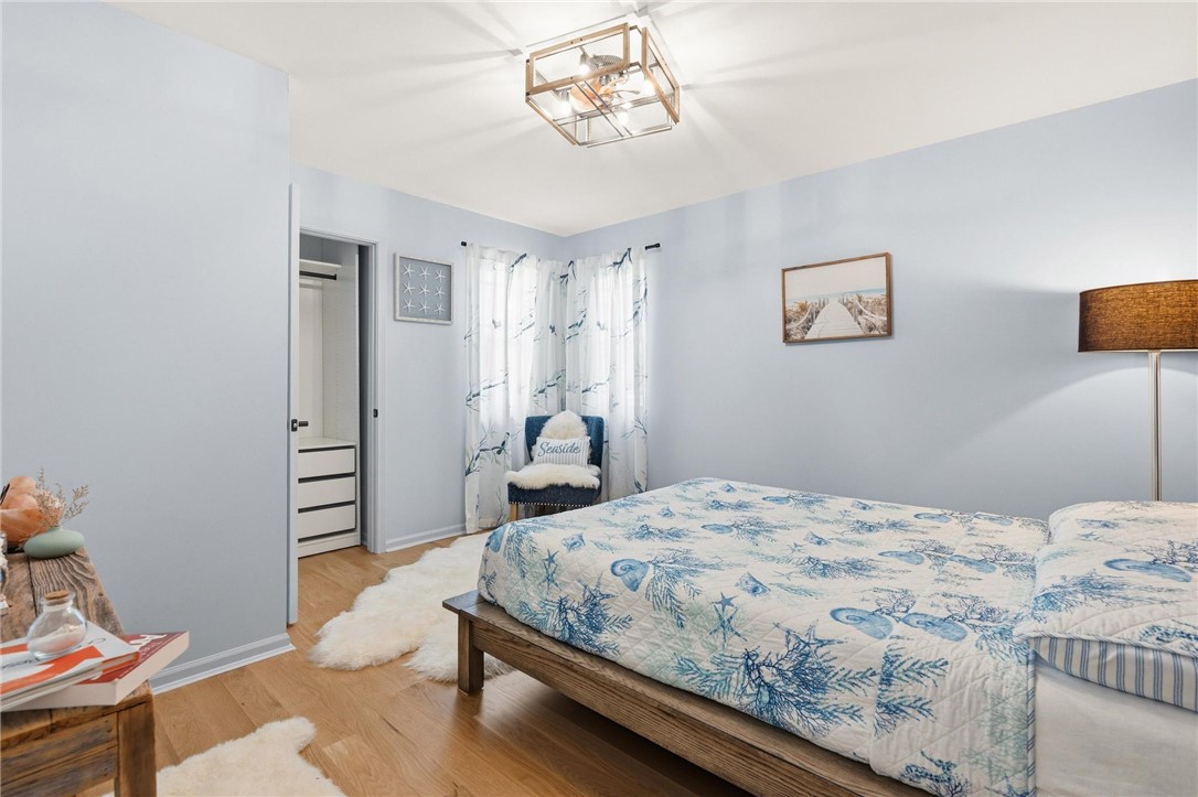 8781 Rupp Farm Drive West Chester, OH 45069 - Photo 25 of 48 This cozy bedroom features durable hardwood flooring and a stylish ceiling fan for comfort.