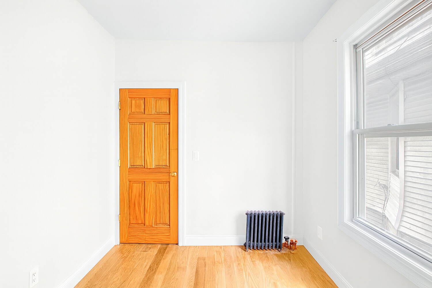 405 East 2nd Street, Unit 2 Brooklyn, NY 11218 - Photo 11 of 16 a room with a window and wooden floor