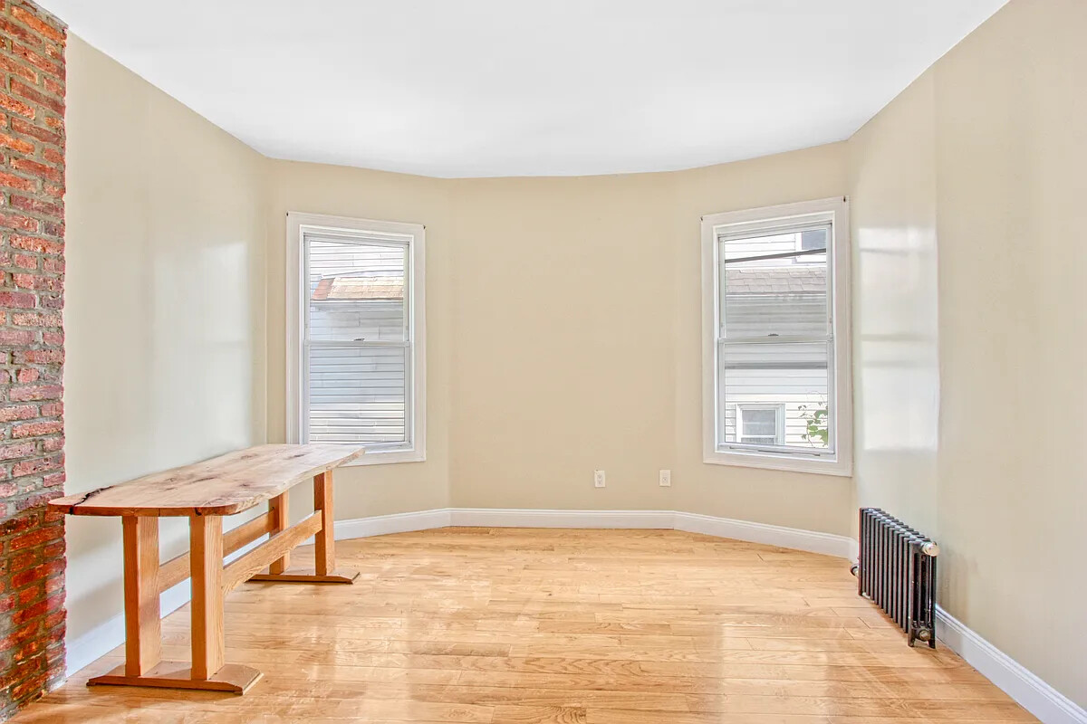 405 East 2nd Street, Unit 2 Brooklyn, NY 11218 - Photo 2 of 16 a view of an empty room with a window
