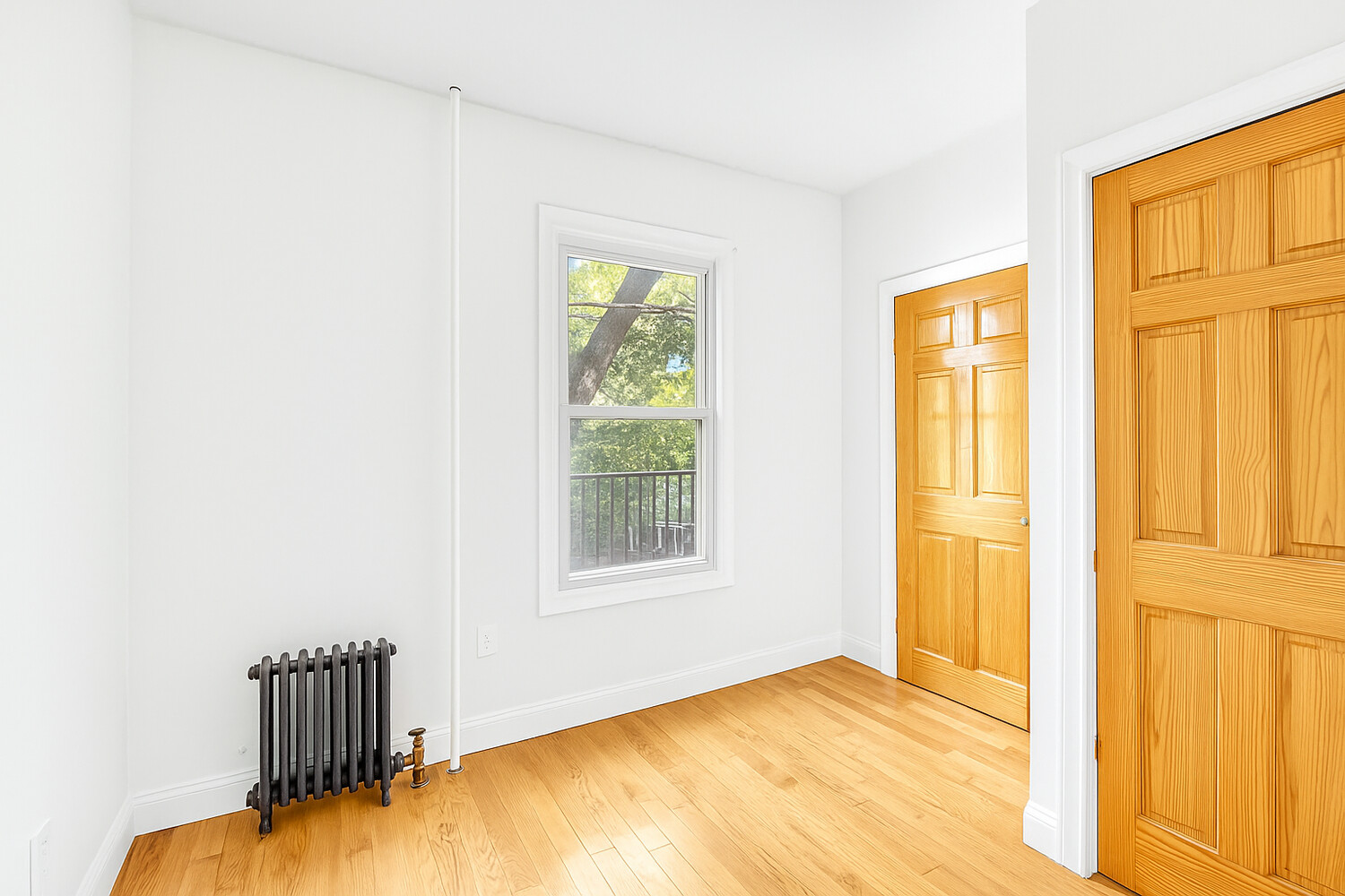 405 East 2nd Street, Unit 2 Brooklyn, NY 11218 - Photo 9 of 16 a view of an empty room with a window