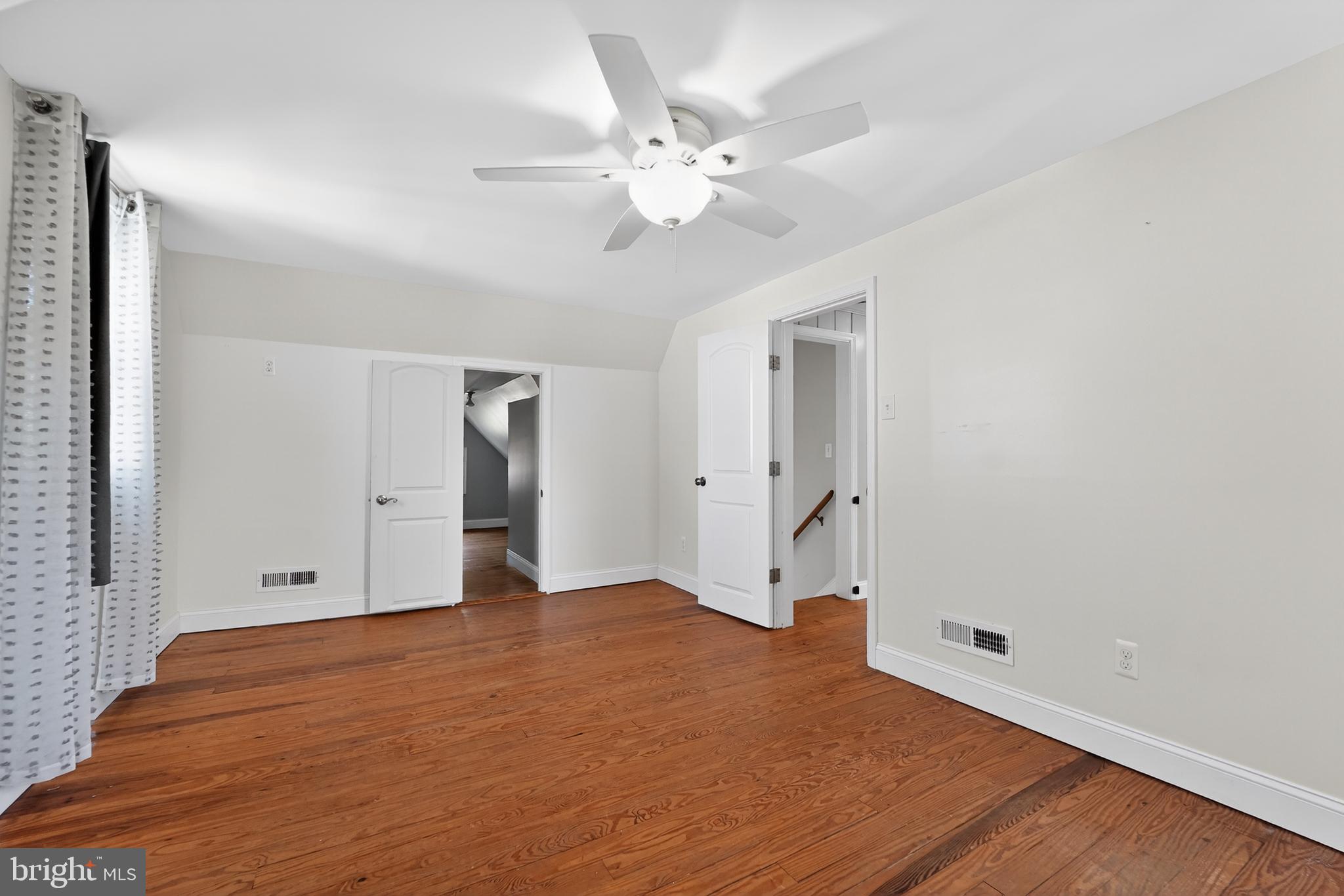 9408 Dana Vista Road Baltimore, MD 21236 - Photo 32 of 38 a view of an empty room with wooden floor