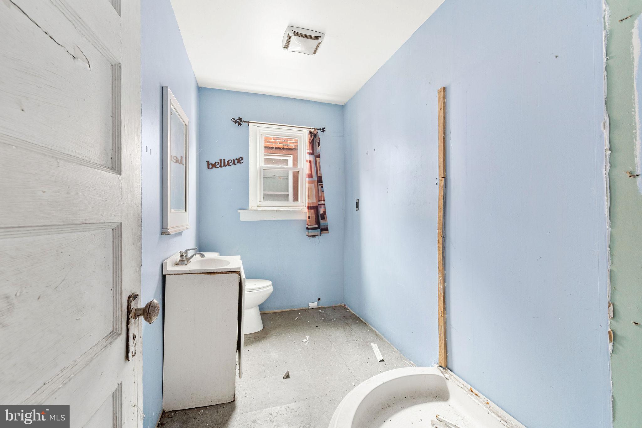 1401 Princess Avenue Camden, NJ 08103 - Photo 19 of 25 a bathroom with a sink toilet and mirror