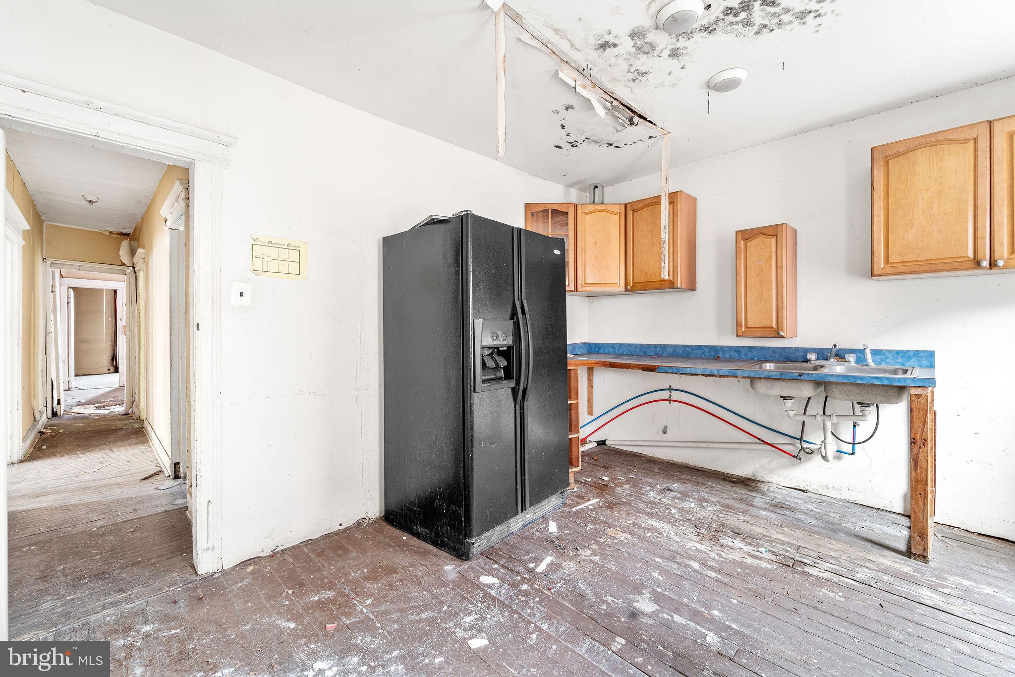 1401 Princess Avenue Camden, NJ 08103 - Photo 22 of 25 a view of a kitchen with a refrigerator and a sink