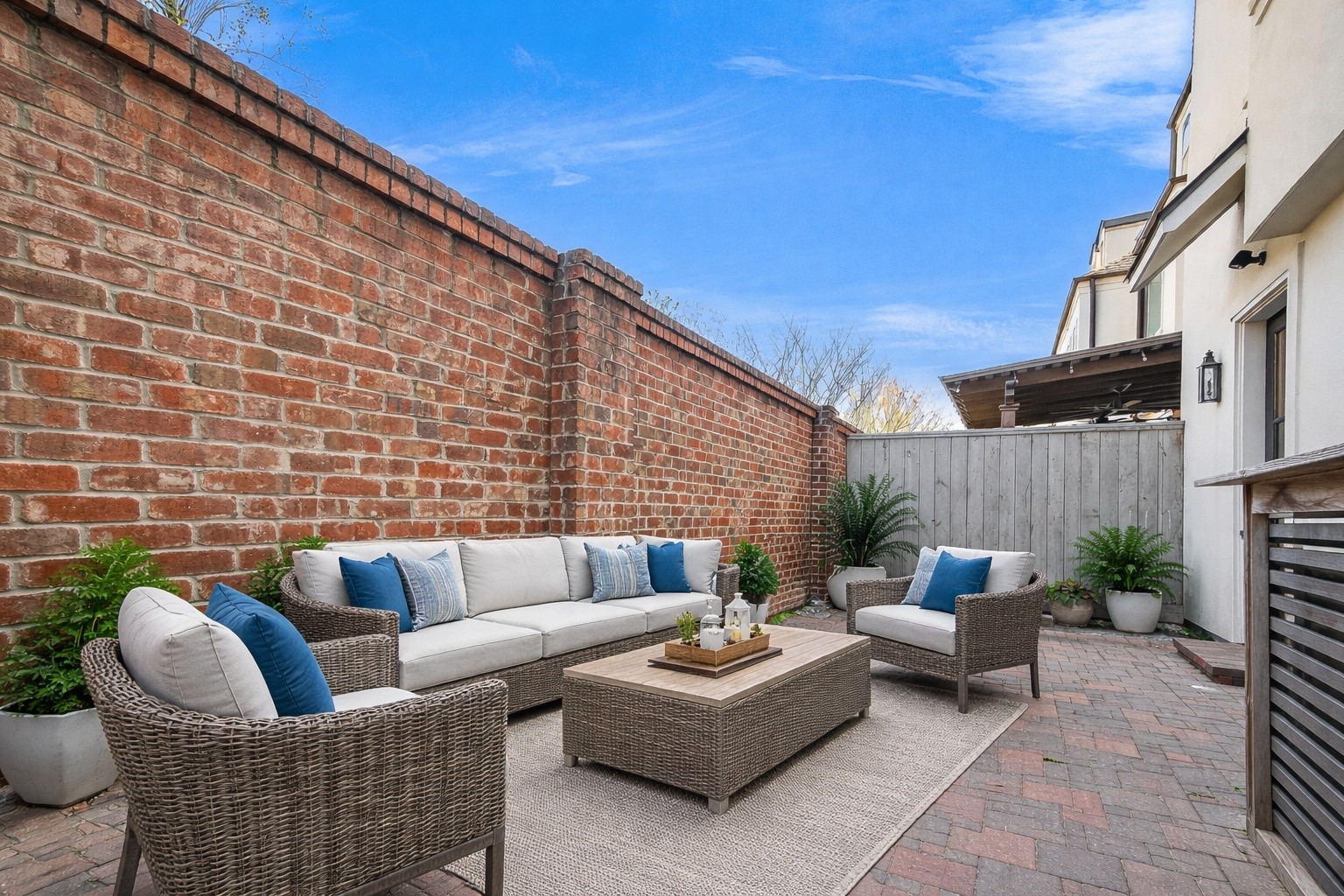 122 Gateway Park Place Spring, TX 77380 - Photo 39 of 44 Private brick-walled courtyard with paver patio and covered entry, perfect for quiet outdoor living.